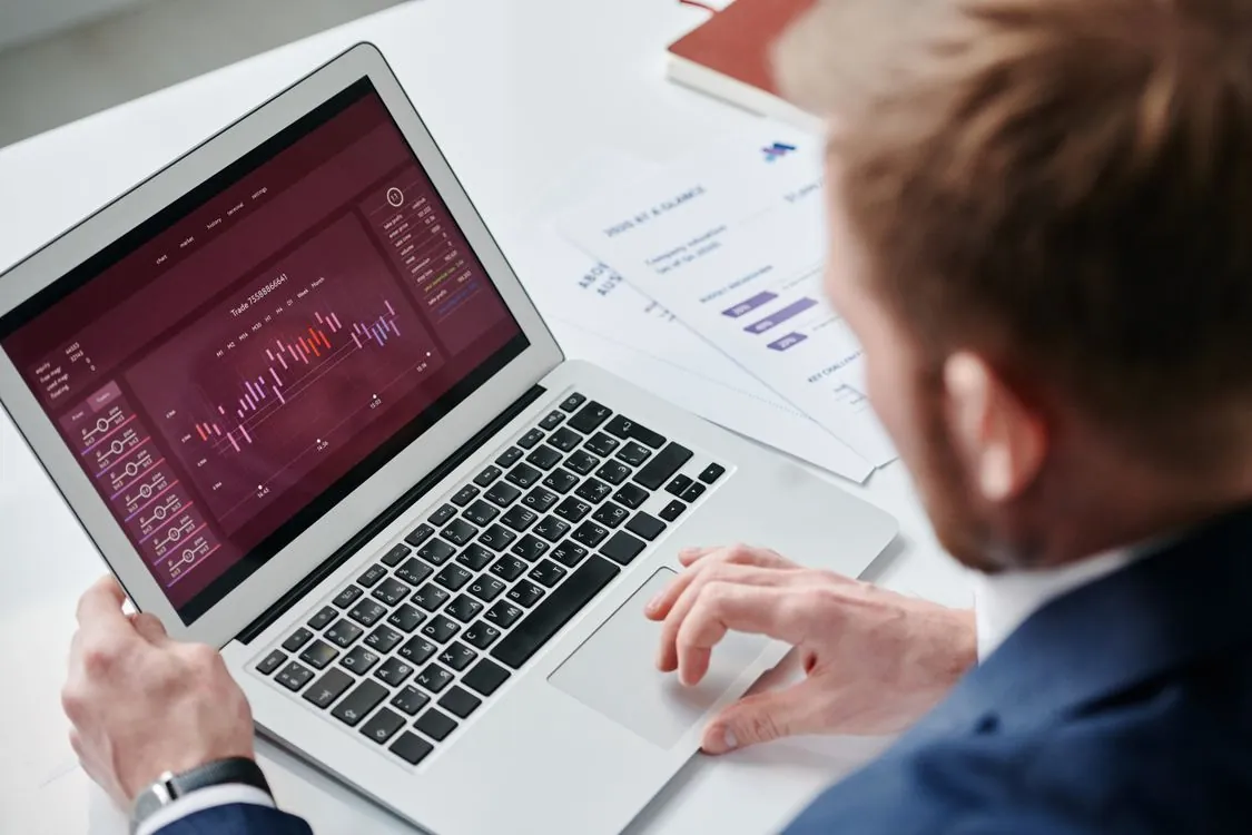 HR professional reviewing candidate documents at desk