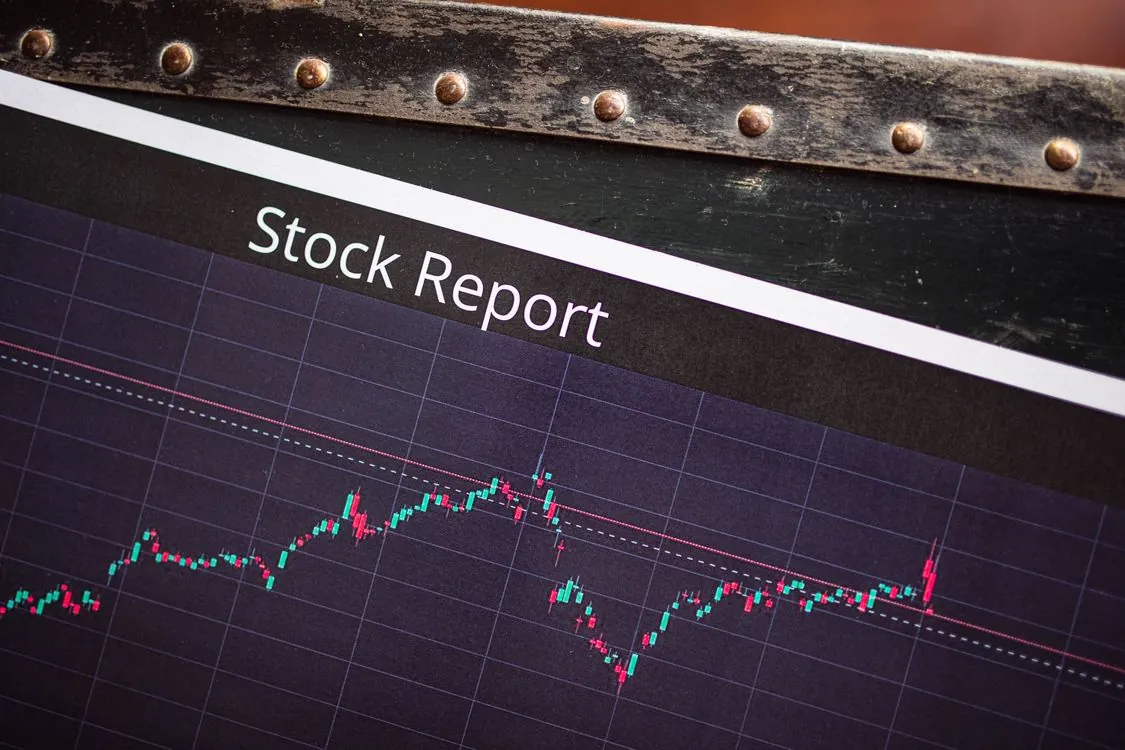 Financial trading display with stock price charts and market data
