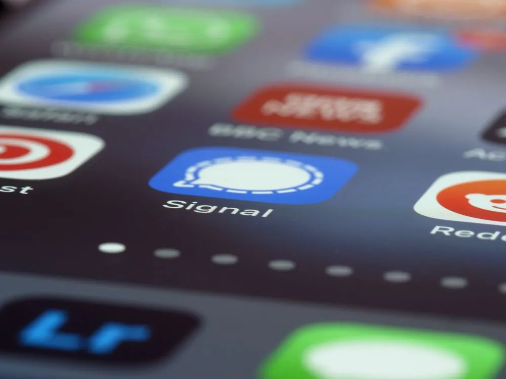 Smartphone displaying secure encrypted messaging app interface
