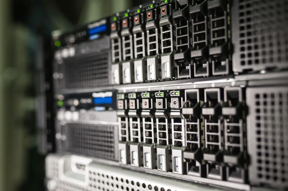 Cloud engineer reviewing infrastructure configuration and compliance status across monitoring screens
