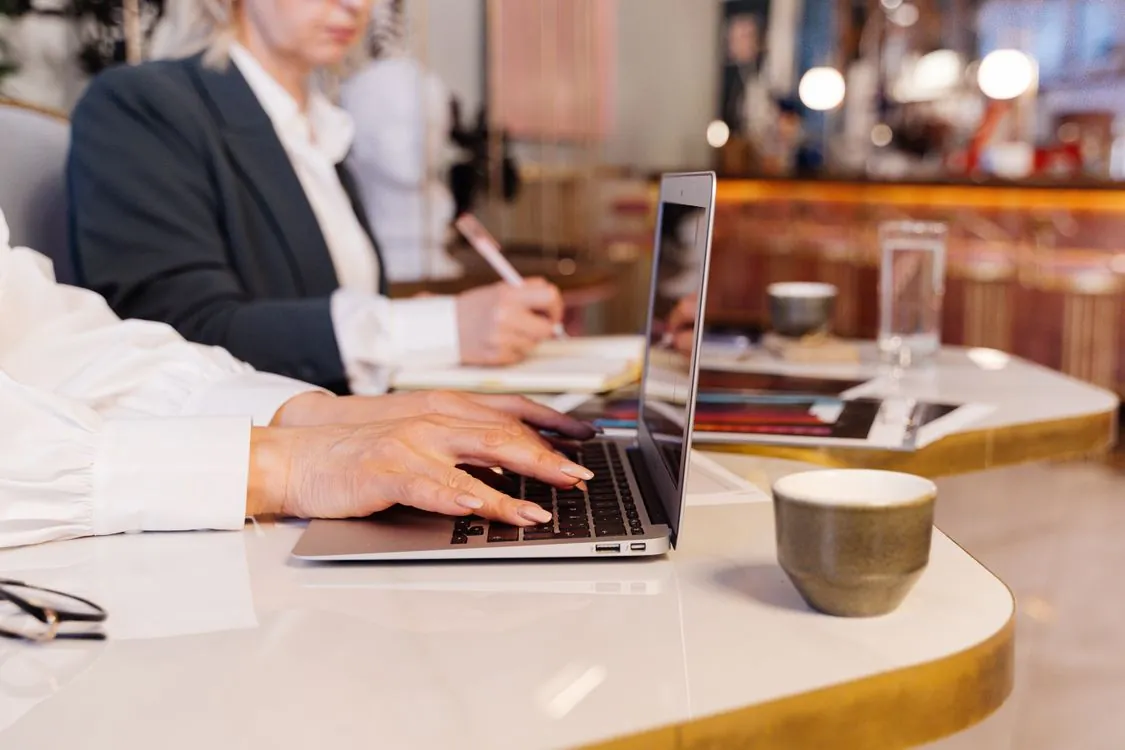 Business professional working on a laptop in a modern office