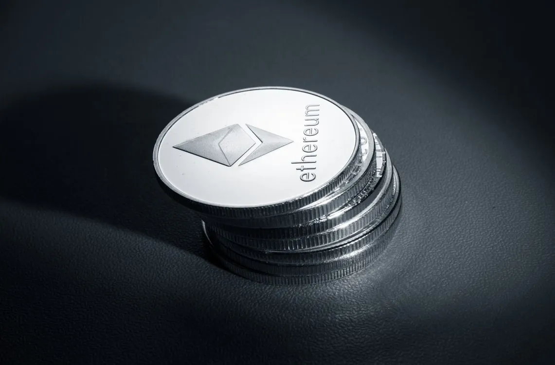 Close-up of stacked Ethereum coins representing blockchain account security and cryptographic protection