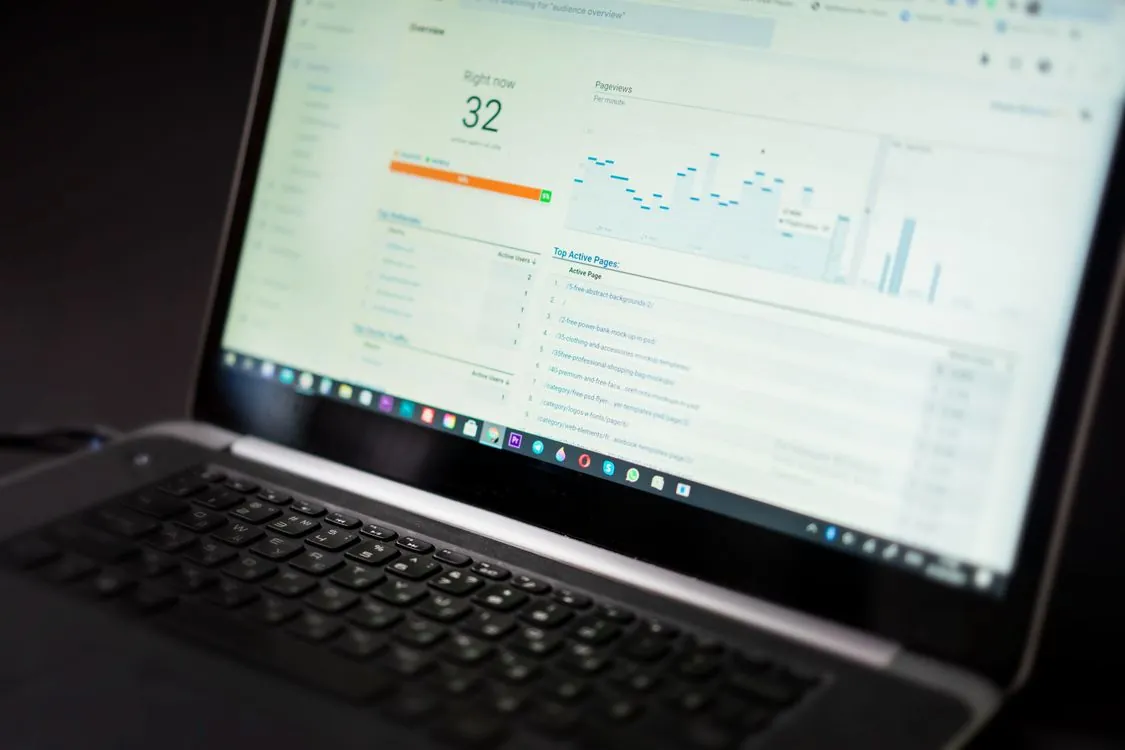 Laptop screen displaying a real-time analytics dashboard tracking latency and performance metrics for voice AI systems