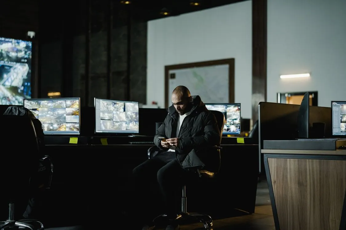 Security analysts monitoring network traffic dashboards in a security operations center