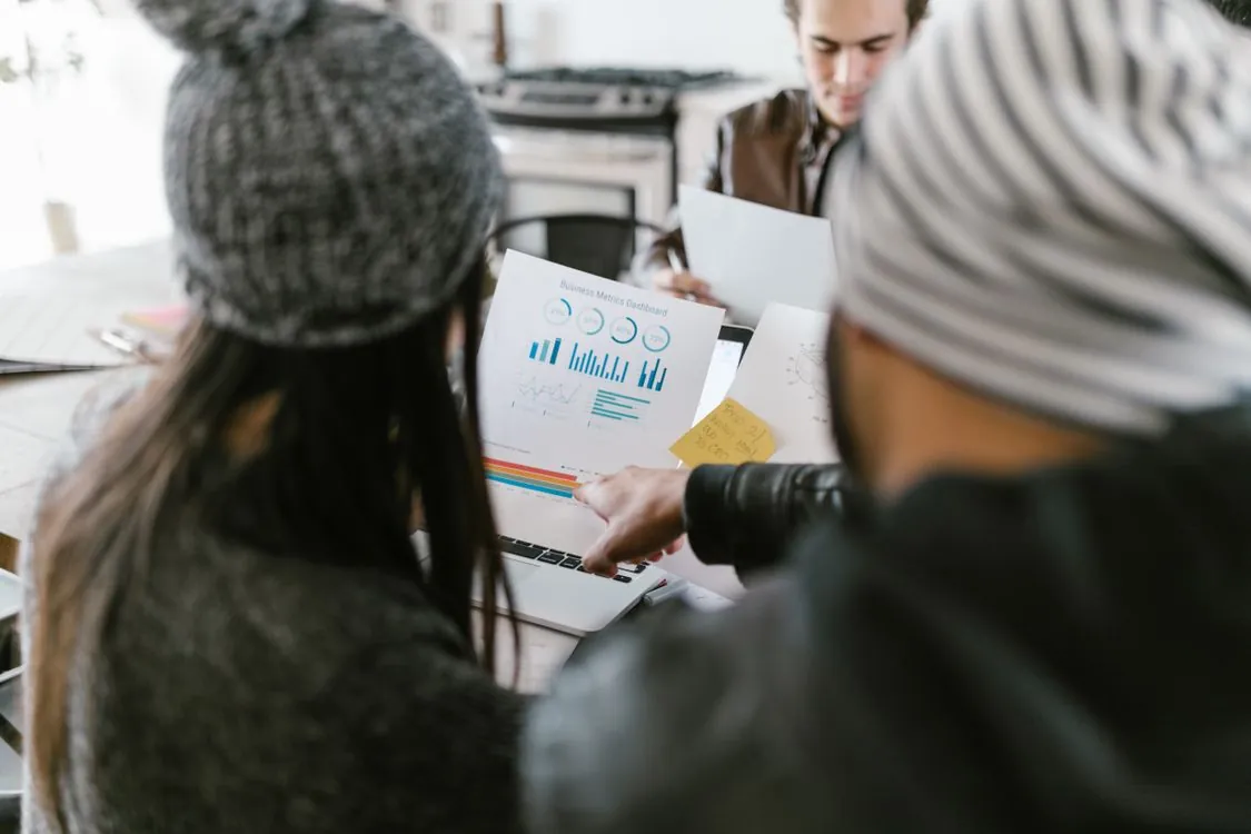 Team comparing business performance metrics