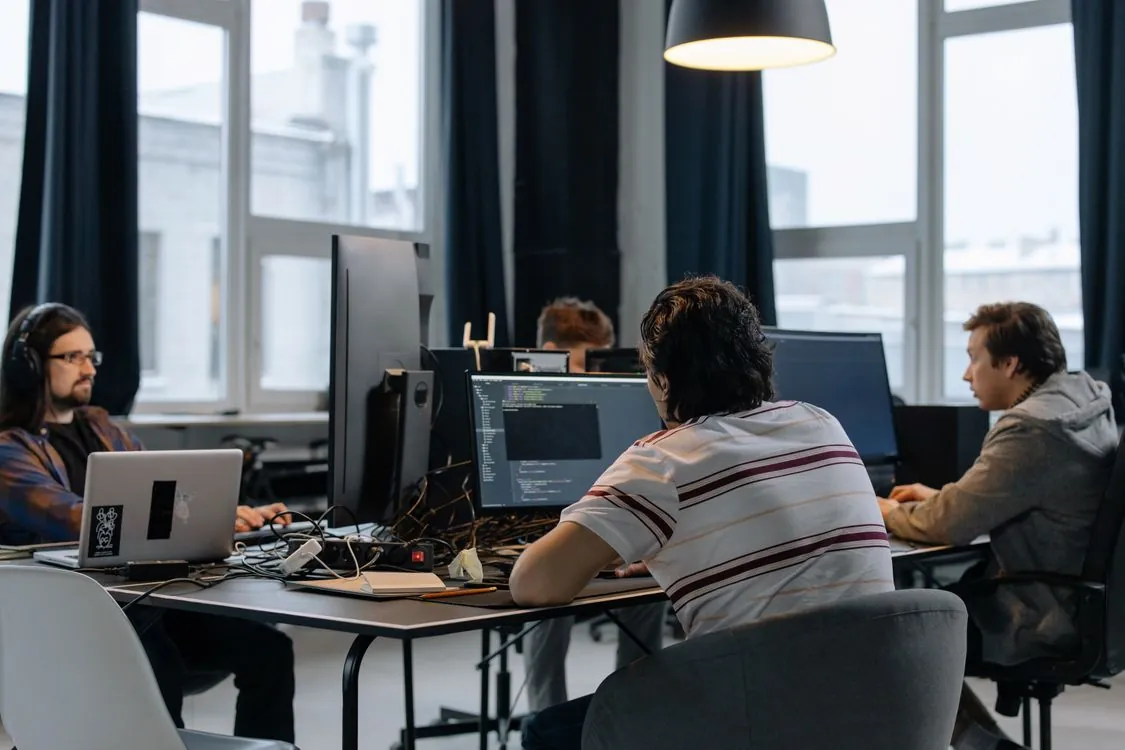 Software developers collaborating on technical documentation