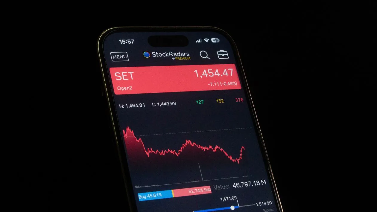 Electronic stock ticker board showing index levels at the closing bell