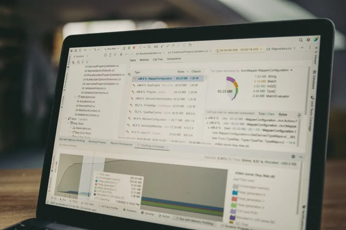 Close-up of a laptop screen showing a coding and data analysis interface, representing OpenTelemetry metrics and logs export.